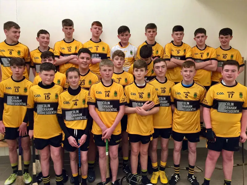 St Enda's GAC young hurlers in amber and black jerseys sponsored by Colin Graham Residential